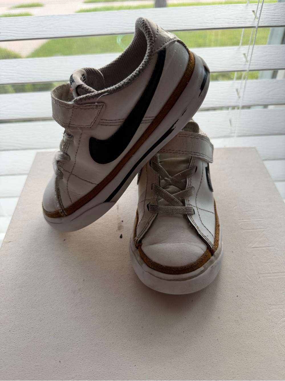 Nike Kids White Sneakers with Black Swoosh and Brown Trim